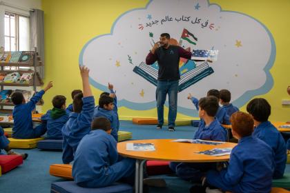 children reading in school library